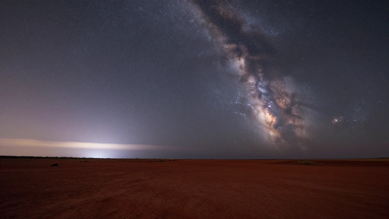 夜明けの荒野と星空のイメージ